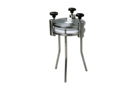 The Filter Holder for In-Line Filtration is a stainless steel unit with three tall legs, a circular base, and a lid secured by three black knobs, designed to hold filter membranes during filtration.