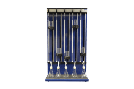 The Calcimeter is a laboratory apparatus featuring five vertical glass rods with clamps for burettes positioned above five conical flasks, designed for chemical experiments and precise liquid dispensing.