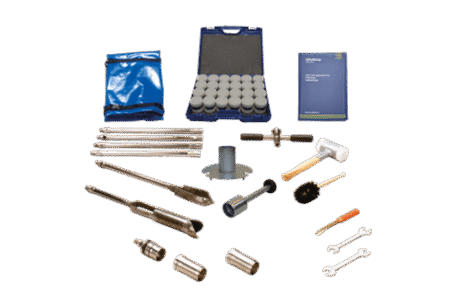 The Soil Sampling Ring Kit - Model C53 includes metal tools, sample containers in a blue case, spanners, a hammer, brushes, rods, and a blue carrying pouch, all neatly arranged on a white background.