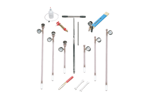 The Tensiometer Set – to a Depth of 90cm, displayed on a white background, includes clear gauges with tubing, a blue utility knife, cleaning brush, small spanners, valves, and a bottle with attached tube.