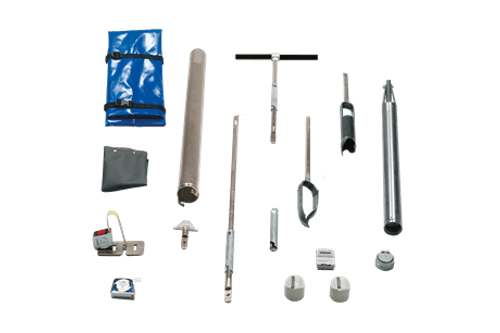 The Hydraulic Conductivity Test Kit includes metal probes, augers, sample containers, handles, and a blue carrying case, all arranged neatly on a white background.