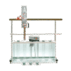 A Pipette Apparatus is set up in a laboratory with a water tank, vertical rods, and multiple containers in front of the tank, all against a plain white background.