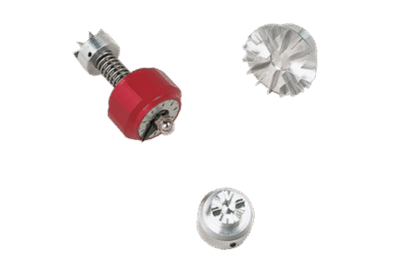 The Pocket Vane Tester Set – with 3 vanes – is shown on a white background: one vane has a red casing and spring, whilst the other two are silver with sharp ridges.