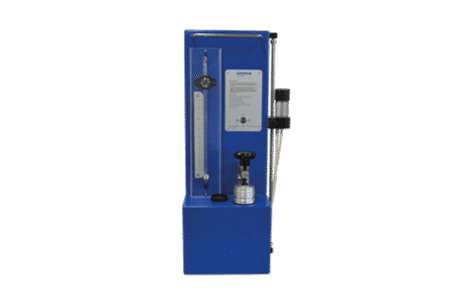 The Air Pycnometer According to Langer is a blue laboratory apparatus with a vertical flowmeter, control valve, and transparent tubes, designed for measuring gas permeability in materials.