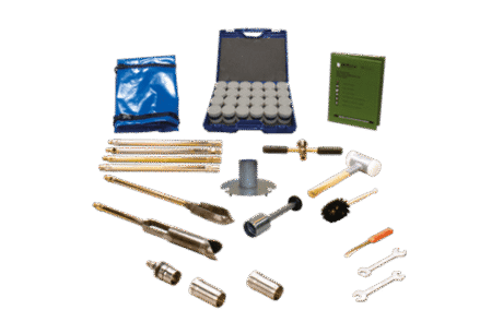 The Soil Sampling Ring Kit - Model E53 includes metal rods, sample containers in a blue case, a mallet, spanners, a brush, a blue bag, and a green instruction manual—all arranged on a white surface.