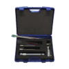 A blue plastic case with foam insert holds the Hand-Penetrometer for Top Layers - IB and its metal components, including rods, a handle, and attachments, all arranged neatly inside. The case is open and viewed from above.