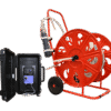 An MP1 Submersible Pump on a large red wheeled hose reel is placed next to an open black case with electronic equipment, connected by cables, all set against a plain white background.