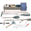 The Two-Piece Root Auger Set is shown with tools such as spanners, a mallet, rods, a brush, gloves, a manual, and a metal carrying case—all arranged neatly on a white background.